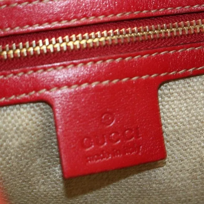 Vintage, Gucci, new Jackie style, red leather with a red, white, & blue center Sherry stripe, triangular shape, & gold hook closure